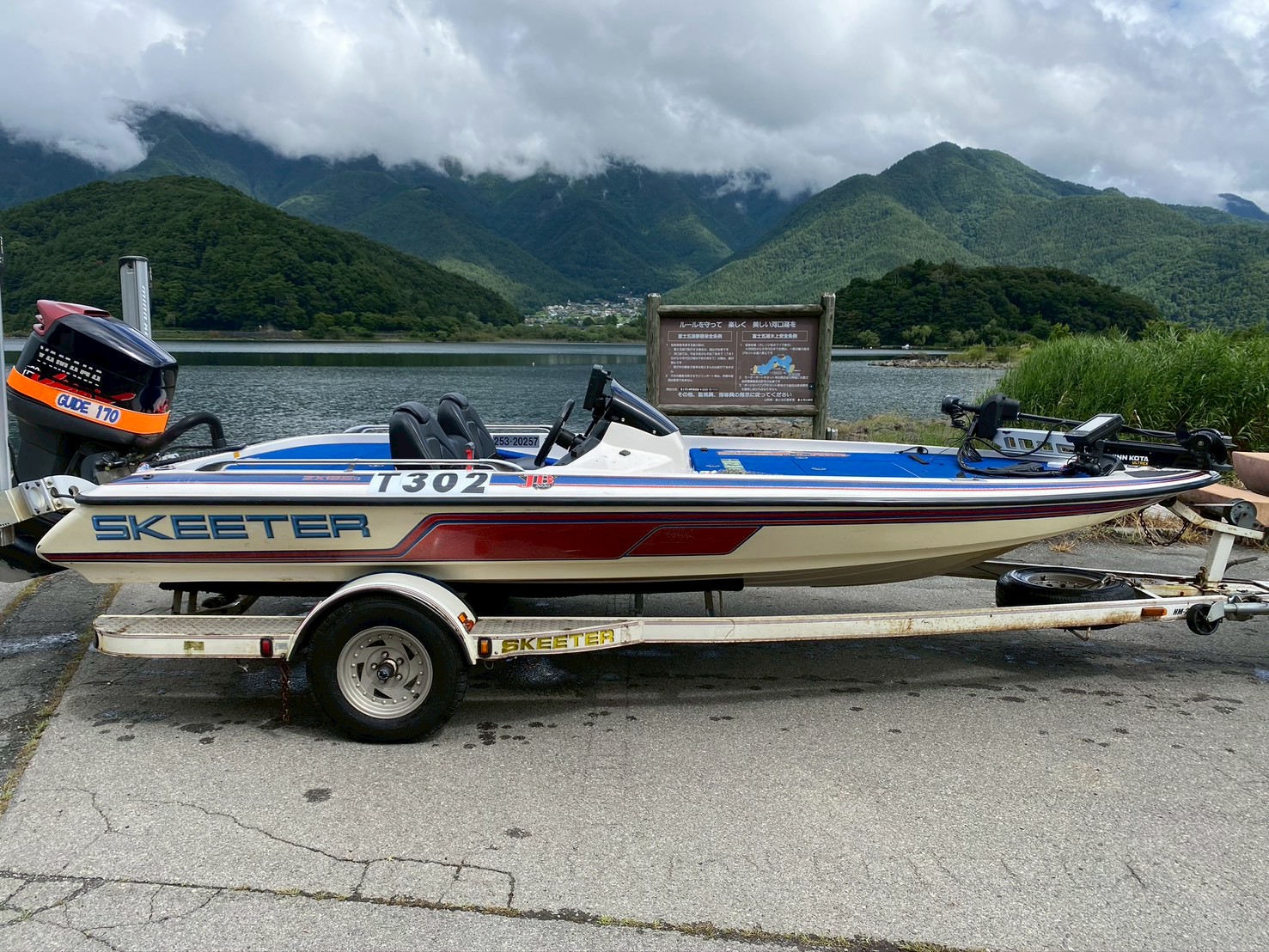 Skeeter ZX185c bass boat on its trailer with the mountains of Lake Kawaguchi behind
